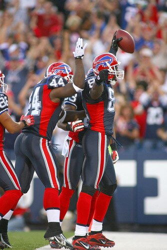 ORCHARD PARK, NY - SEPTEMBER 20: Terrell Owens #81, Xavier Omon #44 and Lee Evans #83 of the Buffalo Bills celebrate Owens scoring his first touchdown as a Bill on a 43 yard pass reception against the Tampa Bay Buccaneers at Ralph Wilson Stadium on September 20, 2009 in Orchard Park, New York.  <br /><br /><span class="help">(Photo by Rick Stewart/Getty Images)</span>