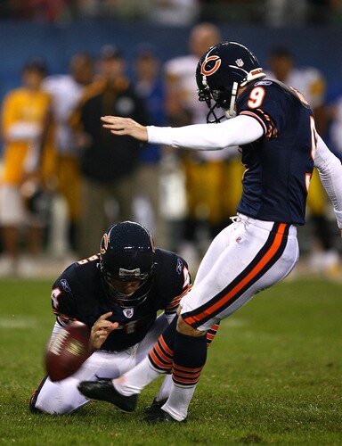CHICAGO - SEPTEMBER 20: Robbie Gould #9 of the Chicago Bears kicks the game-winning field goal out of the hold of Brad Maynard #4 against the Pittsburgh Steelers on September 20, 2009 at Soldier Field in Chicago, Illinois. The Bears defeated the Steelers 17-14. <br /><br /><span class="help">(Photo by Jonathan Daniel/Getty Images)</span>