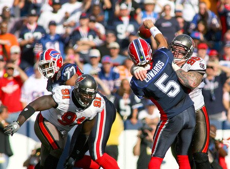 ORCHARD PARK, NY - SEPTEMBER 20:  Trent Edwards #5 of the Buffalo Bills is hit by Chris Hovan #95 of the Tampa Bay Buccaneers as Stylez G. White #91 moves in at Ralph Wilson Stadium on September 20, 2009 in Orchard Park, New York. Buffalo won 33-20.  <br /><br /><span class="help">(Photo by Rick Stewart/Getty Images)</span>