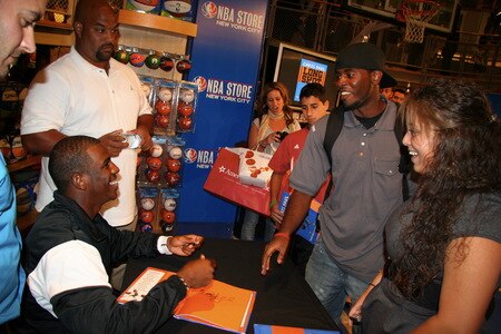 NEW YORK - SEPTEMBER 21:  Chris Paul of the New Orleans Hornets jokes with a fan as he does a signing of his book titled "Long Shot: Never Too Small to Dream Big" at the NBA Store on September 21, 2009 in New York CIty.<br /><br /><span class="help">(Photo by Brian Choi/NBAE via Getty Images)</span>