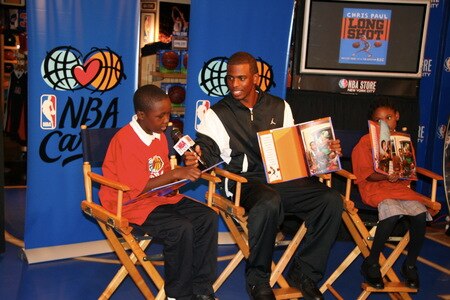 NEW YORK - SEPTEMBER 21:  Chris Paul of the New Orleans Hornets does a reading with some kids from his book titled "Long Shot: Never Too Small to Dream Big" at the NBA Store on September 21, 2009 in New York CIty.<br /><br /><span class="help">(Photo by Brian Choi/NBAE via Getty Images)</span>