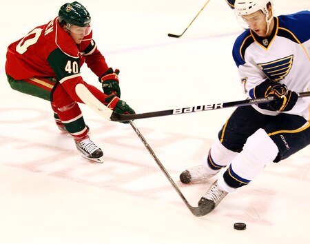 ST. PAUL, MN - SEPTEMBER 24:  Danny Irmen #40 of the Minnesota Wild tries to get the puck away from Alex Pietrangelo #7 of the St. Louis Blues at the Xcel Energy Center on September 24, 2009 in St. Paul, Minnesota. The Blues defeated the Wild 4-1. <br /><br /><span class="help">(Photo by Genevieve Ross/Getty Images)</span>