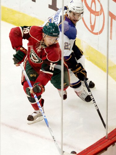 ST. PAUL, MN - SEPTEMBER 24:  Andy Hilbert #19 of the Minnesota Wild tries to keep the puck away from Alex Pietrangelo #27 of the St. Louis Blues at the Xcel Energy Center on September 24, 2009 in St. Paul, Minnesota. The Blues defeated the Wild 4-1. <br /><br /><span class="help">(Photo by Genevieve Ross/Getty Images)</span>