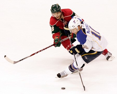 ST. PAUL, MN - SEPTEMBER 24:  Andy McDonald #10 of the St. Louis Blues controls the puck away from Brent Burns #8 of the Minnesota Wild  in the second period at the Xcel Energy Center on September 24, 2009 in St. Paul, Minnesota. The Blues defeated the Wild 4-1. <br /><br /><span class="help">(Photo by Genevieve Ross/Getty Images)</span>