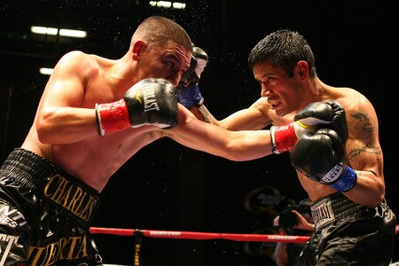LOS ANGELES, CA - SEPTEMBER 24:  Charles Huerta exchanges punches with opponent Rodrigo Aranda at the Nokia Center on September 24, 2009 in Los Angeles, California. Huerta defeated Aranda  <br /><br /><span class="help">(Photo by Jacob de Golish/Getty Images)</span>
