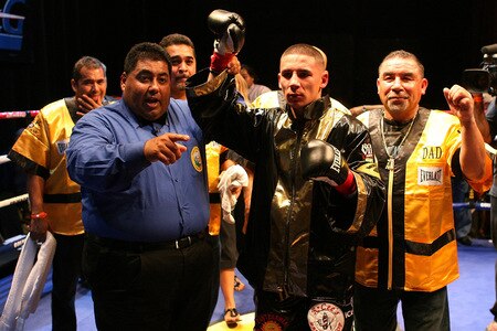 LOS ANGELES, CA - SEPTEMBER 24:  Charles Huerta celebrates his victory with his corner after he beats opponent Rodrigo Aranda at the Nokia Center on September 24, 2009 in Los Angeles, California. Huerta defeated Aranda  <br /><br /><span class="help">(Photo by Jacob de Golish/Getty Images)</span>