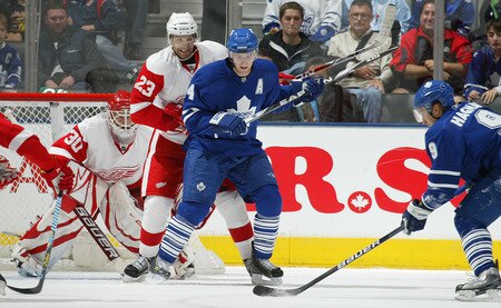 TORONTO, ON - SEPTEMBER 26:   Matt Stajan #14 of the Toronto Maple Leafs looks to tip a shot in front of defender Brad Stuart #23 of the Detroit Red Wings in a pre-season game on September 26, 2009 at the Air Canada Centre in Toronto, Ontario.<br /><br /><span class="help">(Photo by Claus Andersen/Getty Images)</span>