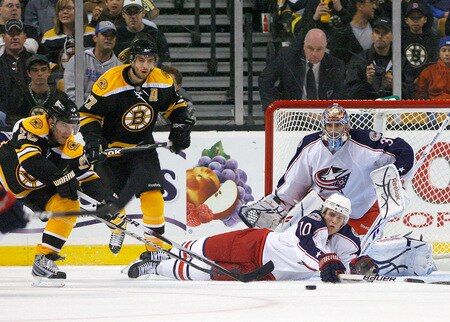 BOSTON, MA - SEPTEMBER 26:  Kris Russell #10 of the Columbus Blue Jackets helps his goalie Mathieu Garon #32 defend against Mark Recchi #28 and Zdeno Chara #33 of the Boston Bruins during preseason play at the TD Banknorth Garden on September 26, 2009 in Boston, Massachusetts.  <br /><br /><span class="help">(Photo by Jim Rogash/Getty Images)</span>