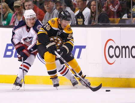 BOSTON, MA - SEPTEMBER 26:  Mark Recchi #28 of the Boston Bruins is chased by Kris Russell #10 of the Columbus Blue Jackets during preseason play at the TD Banknorth Garden on September 26, 2009 in Boston, Massachusetts.  <br /><br /><span class="help">(Photo by Jim Rogash/Getty Images)</span>