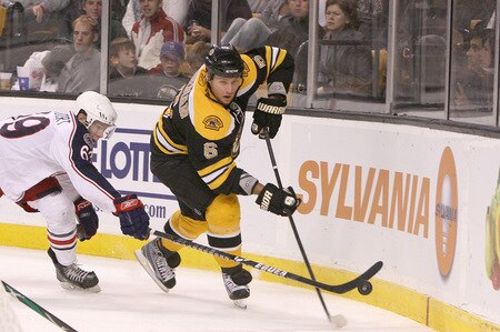 BOSTON, MA - SEPTEMBER 26: Dennis Wideman #6 of the Boston Bruins is pressed by Matt Calvert #69 of the Columbus Blue Jackets at the TD Banknorth Garden during preseason play on September 26, 2009 in Boston, Massachusetts.<br /><br /><span class="help">(Photo by Jim Rogash/Getty Images)</span>