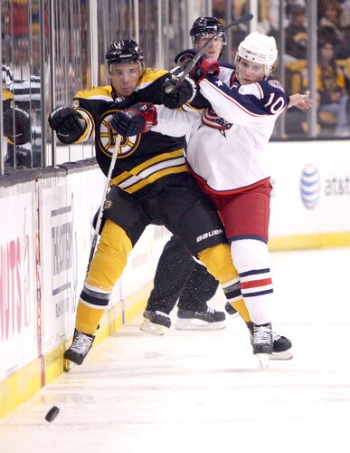 BOSTON, MA - SEPTEMBER 26:  Kris Russell #10 of the Columbus Blue Jackets collides with Chuck Kobasew #12 of  the Boston Bruins at the TD Banknorth Garden during preseason play on September 26, 2009 in Boston, Massachusetts.  <br /><br /><span class="help">(Photo by Jim Rogash/Getty Images)</span>
