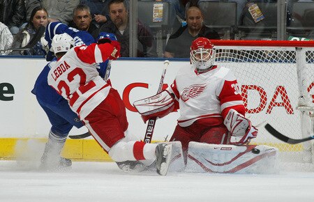 TORONTO, ON SEPTEMBER 26:  Chris Osgood #30 of the Detroit Red Wings makes a stop in a pre-season game against the Toronto Maple Leafs on September 26, 2009 at the Air Canada Centre in Toronto, Ontario.<br /><br /><span class="help">(Photo by Claus Andersen/Getty Images)</span>
