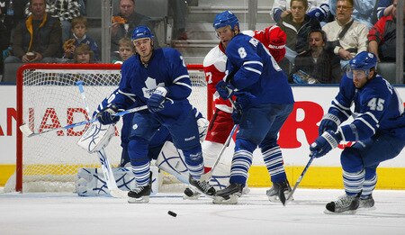TORONTO, ON - SEPTEMBER 26:  Mike Komisarek #8 and Ian White #7 of the Toronto Maple Leafs watch an incoming shot in a pre-season game against the Detroit Red Wings on September 26, 2009 at the Air Canada Centre in Toronto, Ontario. The Leafs defeated the Red Wings 2-1. <br /><br /><span class="help">(Photo by Claus Andersen/Getty Images)</span>