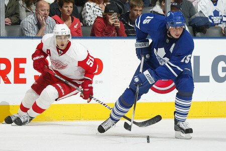 TORONTO, ON - SEPTEMBER 26:  Tomas Kaberle #15 of the Toronto Maple Leafs clears the puck away in a pre-season game against the Detroit Red Wings on September 26, 2009 at the Air Canada Centre in Toronto, Ontario. The Leafs defeated the Red Wings 2-1. <br /><br /><span class="help">(Photo by Claus Andersen/Getty Images)</span>