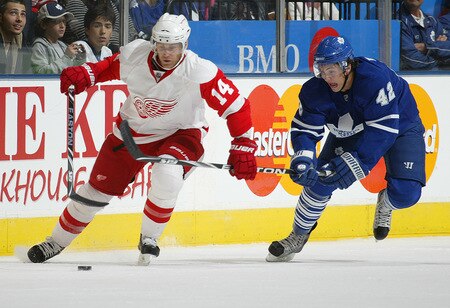 TORONTO, ON SEPTEMBER 26:  Tyler Bozak #42 of the Toronto Maple Leafs tries to check Derek Meech #14 of the Detroit Red Wings in a pre-season game on September 26, 2009 at the Air Canada Centre in Toronto, Ontario.<br /><br /><span class="help">(Photo by Claus Andersen/Getty Images)</span>