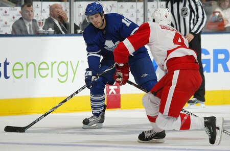 TORONTO, ON - SEPTEMBER 26:  Lee Stempniak #12 of the Toronto Maple Leafs fires a puck past Andy Delmore #4 of the Detroit Red Wings in a pre-season game on September 26, 2009 at the Air Canada Centre in Toronto, Ontario. The Leafs defeated the Red Wings 2-1. <br /><br /><span class="help">(Photo by Claus Andersen/Getty Images)</span>