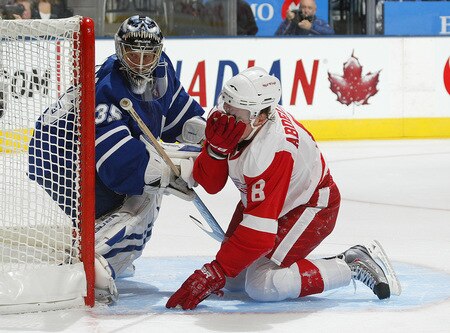TORONTO, ON SEPTEMBER 26:  Vesa Toskala #35 of the Toronto Maple Leafs gets a stick up on Justin Abdelkader #8 of the Detroit Red Wings in a pre-season game against the Toronto Maple Leafs on September 26, 2009 at the Air Canada Centre in Toronto, Ontario.<br /><br /><span class="help">(Photo by Claus Andersen/Getty Images)</span>