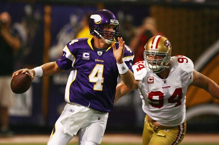 MINNEAPOLIS - SEPTEMBER 27: Brett Favre #4 of the Minnesota Vikings is chased out of the pocket by Pat Williams #94 of the San Francisco 49ers at the Hubert H. Humphrey Metrodome on September 27, 2009 in Minneapolis, Minnesota. <br /><br /><span class="help">(Photo by Jonathan Daniel/Getty Images)</span>