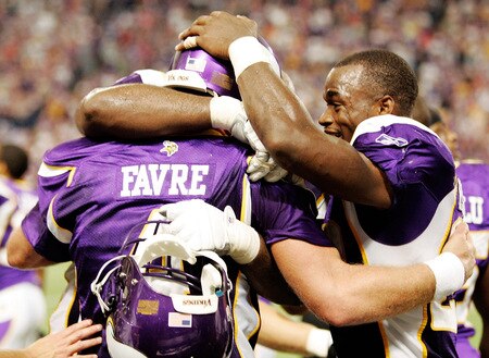 MINNEAPOLIS, MN - SEPTEMBER 27: Quarterback Brett Favre #4 of the Minnesota Vikings celebrates with teammate Adrian Peterson #28 after defeating the San Francisco 49ers 27-24 at Hubert H. Humphrey Metrodome on September 27, 2009 in Minneapolis, Minnesota. Favre threw a 32-yard pass for a touchdown with two seconds left in the game for the win. <br /><br /><span class="help">(Photo by Genevieve Ross/Getty Images)</span>