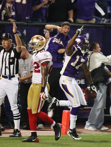 MINNEAPOLIS - SEPTEMBER 27: Greg Lewis #17 of the Minnesota Vikings holds the ball after catching a touchdown pass with two seconds on the clock to defeat Nate Clements #22 and the San Francisco 49ers at the Hubert H. Humphrey Metrodome on September 27, 2009 in Minneapolis, Minnesota. The Vikings defeated the 49ers 27-24. <br /><br /><span class="help">(Photo by Jonathan Daniel/Getty Images)</span>