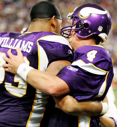 MINNEAPOLIS, MN - SEPTEMBER 27: Quarterback Brett Favre #4 of the Minnesota Vikings celebrates with teammate Kevin Williams after defeating the San Francisco 49ers 27-24 at Hubert H. Humphrey Metrodome on September 27, 2009 in Minneapolis, Minnesota. Favre threw a 32-yard pass for a touchdown with two seconds left in the game for the win. <br /><br /><span class="help">(Photo by Genevieve Ross/Getty Images)</span>