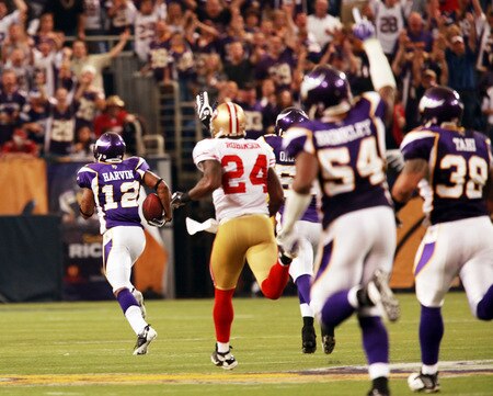 MINNEAPOLIS, MN - SEPTEMBER 27: Percy Harvin #12 of the Minnesota Vikings runs a 101-yard kickoff return for a touchdown in the third quarter against the San Francisco 49ers at Hubert H. Humphrey Metrodome on September 27, 2009 in Minneapolis, Minnesota. The Vikings defeated the 49ers 27-24. <br /><br /><span class="help">(Photo by Genevieve Ross/Getty Images)</span>