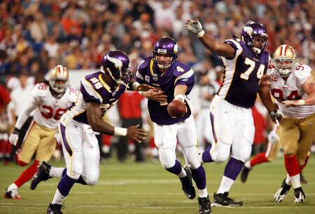 MINNEAPOLIS, MN - SEPTEMBER 27: Quarterback Brett Favre #4 of the Minnesota Vikings hands off the ball to Adrian Peterson #28 against the San Francisco 49ers at Hubert H. Humphrey Metrodome on September 27, 2009 in Minneapolis, Minnesota. Peterson rushed for a total 85 yards and the Vikings defeated the 49ers 27-24. <br /><br /><span class="help">(Photo by Genevieve Ross/Getty Images)</span>