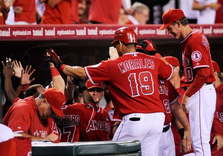 ANAHEIM, CA - SEPTEMBER 28:  Kendry Morales #19 Los Angeles Angels of Anaheim is congratulated by his teammates hitting a two-run home run off pitcher Tommy Hunter of the Texas Rangers during first inning of the baseball game at Angel Stadium on September 28, 2009 in Anaheim, California.  <br /><br /><span class="help">(Photo by Kevork Djansezian/Getty Images)</span>