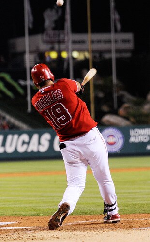 ANAHEIM, CA - SEPTEMBER 28:  Kendry Morales #19 Los Angeles Angels of Anaheim hits a two-run home run to score teammate Vladimir Guerrero # 27 against pitcher Tommy Hunter of the Texas Rangers during first inning of the baseball game at Angel Stadium on September 28, 2009 in Anaheim, California.  <br /><br /><span class="help">(Photo by Kevork Djansezian/Getty Images)</span>