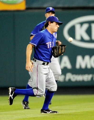 ANAHEIM, CA - SEPTEMBER 28:  Ian Kinsler #5 second baseman of the Texas Rangers bobbles the ball hit by Juan Rivera of the Los Angeles Angels of Anaheim but throws in time to second base to get Rivera during first inning of the baseball game at Angel Stadium on September 28, 2009 in Anaheim, California.  <br /><br /><span class="help">(Photo by Kevork Djansezian/Getty Images)</span>