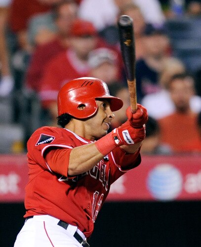 ANAHEIM, CA - SEPTEMBER 28:   Maicer Izturis #13 of the  Los Angeles Angels of Anaheim hits a two-run double to score teammates Vladimir Guerrero and Kendry Morales against the Texas Rangers during fourth inning of the baseball game at Angel Stadium on September 28, 2009 in Anaheim, California.  <br /><br /><span class="help">(Photo by Kevork Djansezian/Getty Images)</span>
