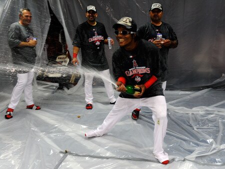 ANAHEIM, CA - SEPTEMBER 28:  Erick Aybar #2 of the Los Angeles Angels of Anaheim sprays his teammates as he celebrates after winning the American League West title in their game against the Texas Rangers at Angel Stadium on September 28, 2009 in Anaheim, California.  <br /><br /><span class="help">(Photo by Kevork Djansezian/Getty Images)</span>
