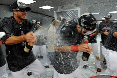 ANAHEIM, CA - SEPTEMBER 28:  A member of the Los Angeles Angels of Anaheim sprays his teammates as he celebrates after winning the American League West title in their game against the Texas Rangers at Angel Stadium on September 28, 2009 in Anaheim, California.  <br /><br /><span class="help">(Photo by Kevork Djansezian/Getty Images)</span>
