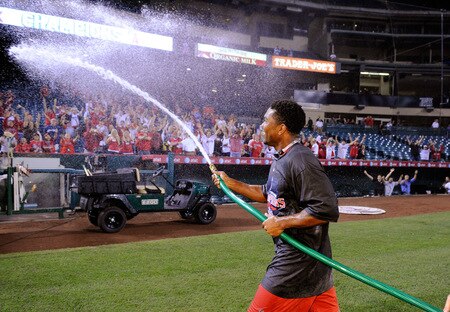 ANAHEIM, CA - SEPTEMBER 28:  Howie Kendrick #47 of the Los Angeles Angels of Anaheim sprays the fans as he celebrates winning the American League West title during their game against the Texas Rangers at Angel Stadium on September 28, 2009 in Anaheim, California.  <br /><br /><span class="help">(Photo by Kevork Djansezian/Getty Images)</span>