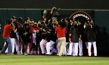 ANAHEIM, CA - SEPTEMBER 28:  Teammates of the late pitcher Nick Adenhart #34 of the Los Angeles Angels of Anaheim pose in front of his banner as they celebrate after winning the American League West title in their game against the Texas Rangers at Angel Stadium on September 28, 2009 in Anaheim, California. Adenhart was killed in a accident by an alleged drunk driver during the beginning of the season.  <br /><br /><span class="help">(Photo by Kevork Djansezian/Getty Images)</span>