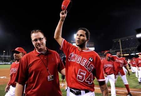 ANAHEIM, CA - SEPTEMBER 28:  Pitcher Ervin Santana (R) of the Los Angeles Angels of Anaheim salutes the fans as walks off the field after pitching a shut out, 11-0, against the Texas Rangers to win the American League West title at Angel Stadium on September 28, 2009 in Anaheim, California.  <br /><br /><span class="help">(Photo by Kevork Djansezian/Getty Images)</span>