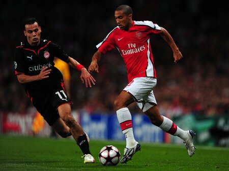 LONDON, ENGLAND - SEPTEMBER 29: Gael Clichy of Arsenal runs with the ball as Jaouad Zairi of Olympiakos defends during the UEFA Champions League Group H match between Arsenal and Olympiakos at the Emirates Stadium on September 29, 2009 in London, England.  <br /><br /><span class="help">(Photo by Mike Hewitt/Getty Images)</span>
