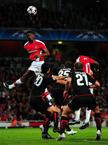 LONDON, ENGLAND - SEPTEMBER 29: Abou Diaby of Arsenal heads the ball during the UEFA Champions League Group H match between Arsenal and Olympiakos at the Emirates Stadium on September 29, 2009 in London, England.  <br /><br /><span class="help">(Photo by Mike Hewitt/Getty Images)</span>