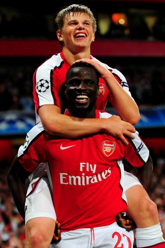 LONDON, ENGLAND - SEPTEMBER 29:  Andrey Arshavin of Arsenal celebrates with his team mate Emmanuel Eboue after Arshavin scored the second goal during the UEFA Champions League Group H match between Arsenal and Olympiakos at the Emirates Stadium on September 29, 2009 in London, England.  <br /><br /><span class="help">(Photo by Mike Hewitt/Getty Images)</span>