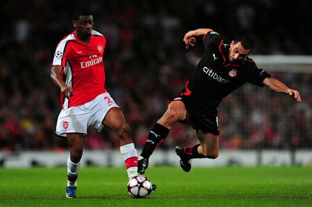 LONDON, ENGLAND - SEPTEMBER 29:  Abou Diaby of Arsenal battles for the ball with Ieroklis Stoltidis of Olympiakos during the UEFA Champions League Group H match between Arsenal and Olympiakos at the Emirates Stadium on September 29, 2009 in London, England.  <br /><br /><span class="help">(Photo by Mike Hewitt/Getty Images)</span>