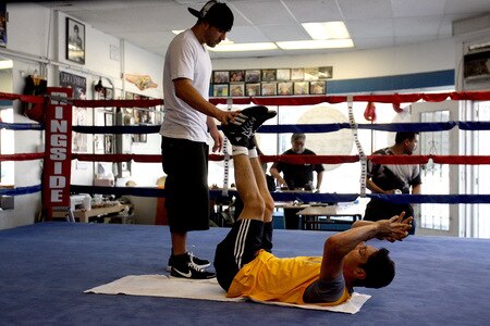 LOS ANGELES, CA - SEPTEMBER 29: Israel Vasquez Two-time Junior Featherweight World Champion does an ab workout during his workout session at Urbina Westside Boxing Gym on September 29, 2009 in Los Angeles, California. Vasquez will return to the ring to face Angel Priolo on October 10, 2009.  <br /><br /><span class="help">(Photo by Jacob de Golish/Getty Images)</span>