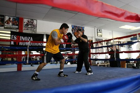 LOS ANGELES, CA - SEPTEMBER 29:  Israel Vasquez Two-time Junior Featherweight World Champion hits the mits with his trainer Rudy Perez during his workout session at Urbina Westside Boxing Gym on September 29, 2009 in Los Angeles, California. Vasquez will return to the ring to face Angel Priolo on October 10, 2009.  <br /><br /><span class="help">(Photo by Jacob de Golish/Getty Images)</span>