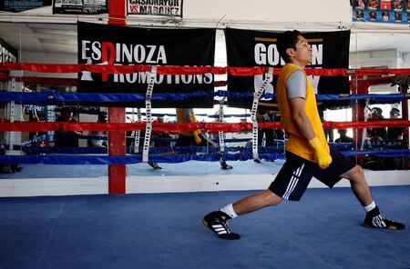 LOS ANGELES, CA - SEPTEMBER 29: Israel Vasquez Two-time Junior Featherweight World Champion stretches before his workout session at Urbina Westside Boxing Gym on September 29, 2009 in Los Angeles, California. Vasquez will return to the ring to face Angel Priolo on October 10, 2009.  <br /><br /><span class="help">(Photo by Jacob de Golish/Getty Images)</span>