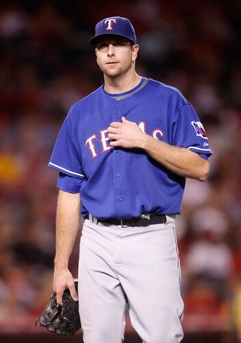 ANAHEIM, CA - SEPTEMBER 29:  Starting pitcher Scott Feldman #39 of the Texas Rangers comes out of the game in the fourth inning against the Los Angeles Angels of Anaheim at Angel Stadium on September 29, 2009 in Anaheim, California.  <br /><br /><span class="help">(Photo by Jeff Gross/Getty Images)</span>