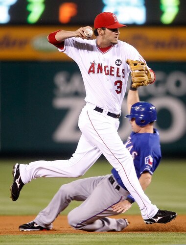 ANAHEIM, CA - SEPTEMBER 29:  Brandon Wood #3 of the Los Angeles Angels of Anaheim runs past Michael young #10 of the Texas Rangers and throws to first to get the out in the first inning at Angel Stadium on September 29, 2009 in Anaheim, California. <br /><br /><span class="help">(Photo by Jeff Gross/Getty Images)</span>