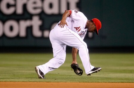ANAHEIM, CA - SEPTEMBER 29:  Howie Kendrick #47 of the Los Angeles Angels of Anaheim fields a ground ball by Ivan Rodriguez of the Texas Rangers in the seventh inning at Angel Stadium on September 29, 2009 in Anaheim, California. The Angels defeated the Rangers 5-2.  <br /><br /><span class="help">(Photo by Jeff Gross/Getty Images)</span>