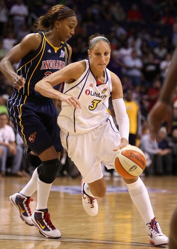 PHOENIX - SEPTEMBER 29:  Diana Taurasi #3 of the Phoenix Mercury drives past Tamika Catchings #24 of the Indiana Fever in Game One of the 2009 WNBA Finals at US Airways Center on August 29, 2009 in Phoenix, Arizona. The Mercury defeated the Fever 120-116 in overtime to take a 1-0 series lead. <br /><br /><span class="help">(Photo by Christian Petersen/Getty Images)</span>