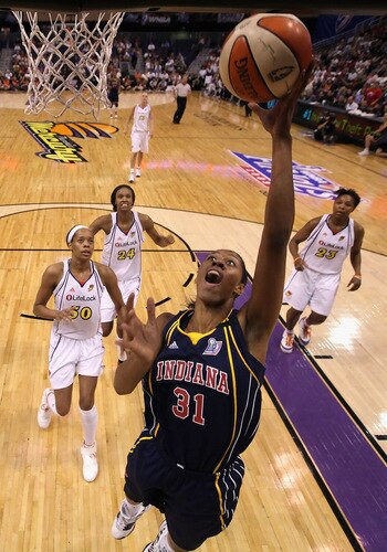PHOENIX - SEPTEMBER 29:  Jessica Moore #31 of the Indiana Fever lays up a shot past Tangela Smith #50, DeWanna Bonner #24 and Cappie Pondexter #23 of the Phoenix Mercury in Game One of the 2009 WNBA Finals at US Airways Center on August 29, 2009 in Phoenix, Arizona.  The Mercury defeated the Fever 120-116 in overtime to take a 1-0 series lead.  <br /><br /><span class="help">(Photo by Christian Petersen/Getty Images)</span>