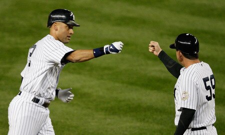 NEW YORK - SEPTEMBER 30: Derek Jeter #2 is congratulated by third base coach Rob Thompson #59 of the New York Yankees after he hit a solo home run in the first inning against the Kansas City Royals during the game on September 30, 2009 at Yankee Stadium in the Bronx borough of New York City. <br /><br /><span class="help">(Photo by Jared Wickerham/Getty Images)</span>