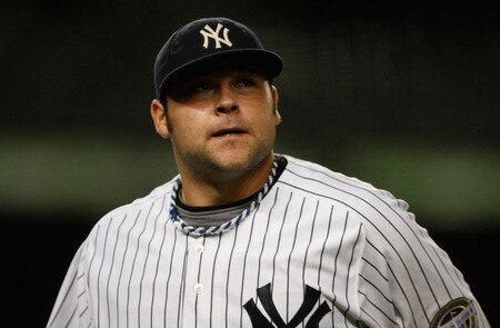 NEW YORK - SEPTEMBER 30: Joba Chamberlain #62 of the New York Yankees walks off the field after being relieved in the 4th inning during the game on September 30, 2009 at Yankee Stadium in the Bronx borough of New York City. <br /><br /><span class="help">(Photo by Jared Wickerham/Getty Images)</span>